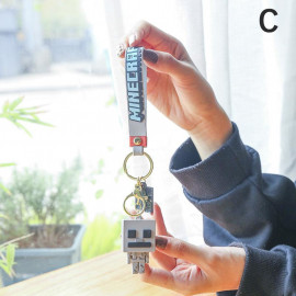 Detská kľúčenka Minecraft Skeleton s pútkom a karabínou